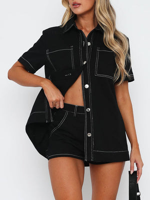 Black contrast stitch utility set with buttoned shirt and shorts.