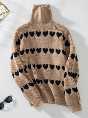 Taupe acrylic turtleneck sweater with black heart intarsia pattern.