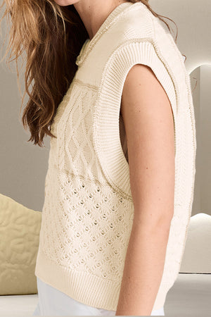 Ivory knit vest with cable and diamond patchwork patterns, crew neck, sleeveless.