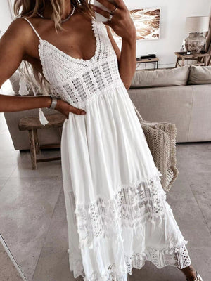 White crochet cami dress with tassels and tiered lace hem.