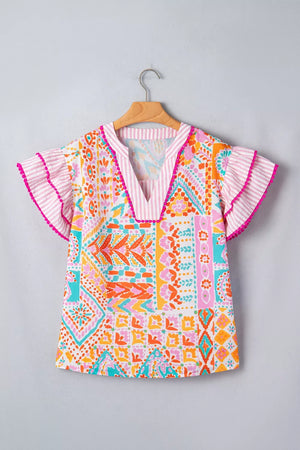 Vibrant patchwork ruffle detail blouse with pink striped trim and flutter sleeves.