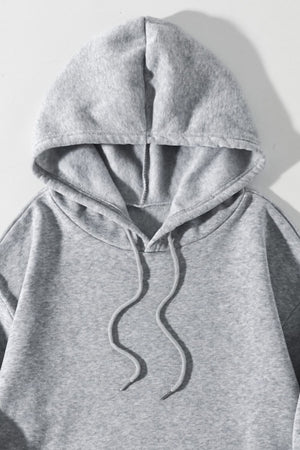 Gray oversized hoodie with drawstring and pouch pocket detail