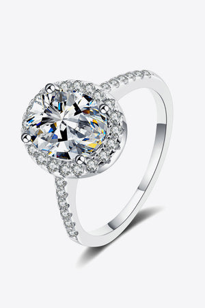 Silver pavé halo solitaire ring with a large center stone and sparkling band.