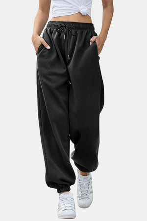 Black relaxed-fit cuffed sweatpants with drawstring waist and pockets.