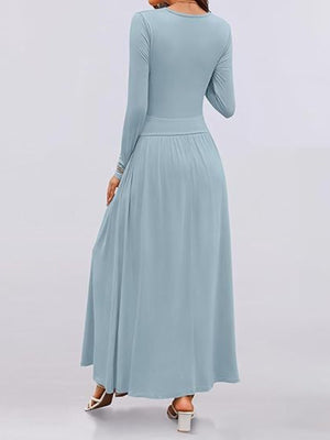 Sky blue ruched maxi dress with pockets, long sleeves, and a cinched waist.