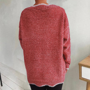 Coral knit sweater with scalloped trim and fuzzy neckline