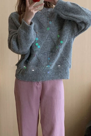 Gray diamond knit sweater with colorful sequin embellishments and crew neck.
