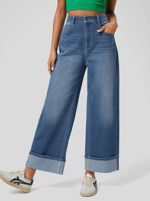 Wide-leg denim jeans in medium wash with contrast cuff and yellow stitching detail.