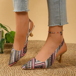 Multicolor geometric patterned slingback kitten heels with pointed toe and kitten heel.