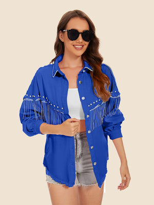 Royal blue denim trucker jacket with fringe and stud embellishments on sleeves and yoke.
