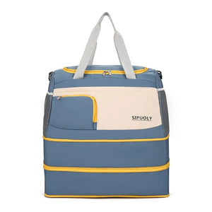 Duffel bag in blue with cream panel, yellow trim, and mesh sides.