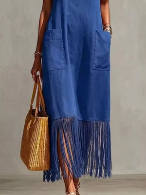 Blue maxi dress with fringe hem, pockets, and side slits.