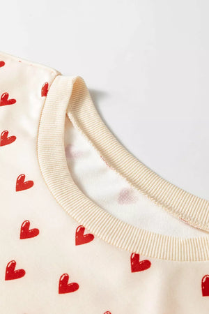 Heart Print Round Neck Long Sleeve Sweatshirt in Cream, model styling view