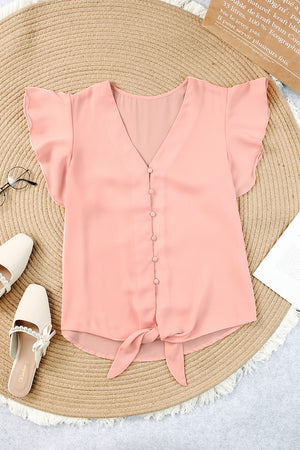 Peach tie-front blouse with ruffle sleeves and button-down V-neck.