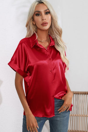 Scarlet satin button-down blouse with cuffed short sleeves.