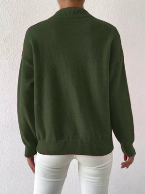 Army green mock neck knit sweater with dropped shoulders and ribbed hem.