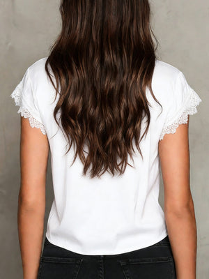 White lace trim short sleeve blouse with a tie front detail.
