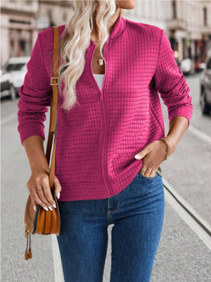 Deep Rose quilted bomber jacket with zip closure and stand-up collar.