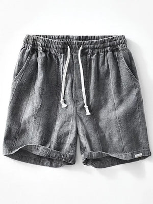Men's relaxed fit gray drawstring shorts with elastic waistband and pockets.