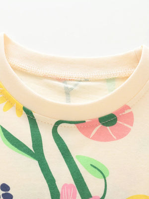 Baby t-shirt with whimsical floral and fruit print, cream cotton, crew neck.