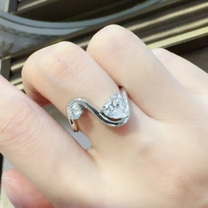 Silver heart-cut diamond infinity ring with two sparkling stones on a sterling silver band.