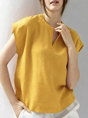 Yellow cap sleeve shirt with notched neckline and relaxed fit.