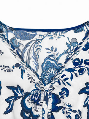 Charming floral midi dress with drawstring waist in dark blue, featuring a button-down neckline.