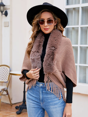 Textured knit poncho in Khaki with faux fur collar and fringe detail.