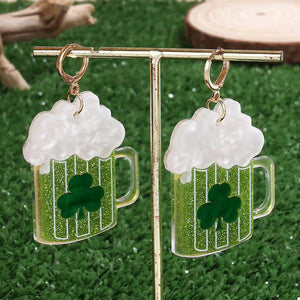Gold dangle earrings with green beer mugs, white foam, and clover charms