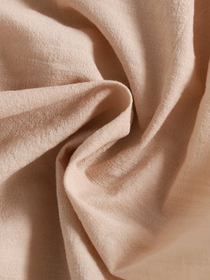 Apricot baby set fabric detail, textured weave