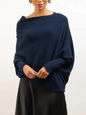 Dark blue off-shoulder drape knit sweater with textured cuffs and batwing sleeves.