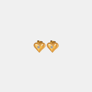 Gold heart stud earrings with a single clear gem detail.