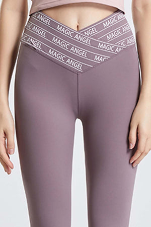 Mauve Angel Band active leggings with a V-waistband and repeating logo detail.