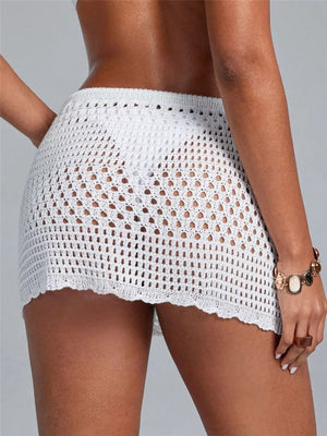 White openwork crochet mini skirt with cutout details and scalloped hem