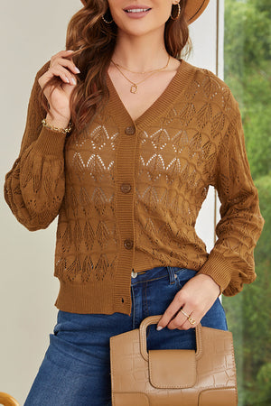 Caramel openwork knit cardigan with balloon sleeves and button front.