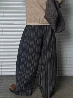 Men's plus size wide leg trousers in black gray with vertical stripes and drawstring detail.