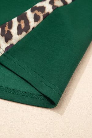 Green polyester tee with leopard accent detail and relaxed fit.