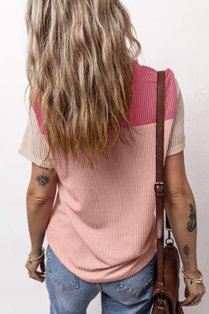 Panelled ribbed tee in blush pink with textured sleeves and a colorblock detail.