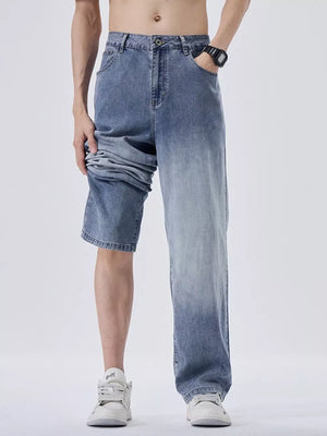 Men's light blue denim sweatpants with a relaxed fit and gradient wash.