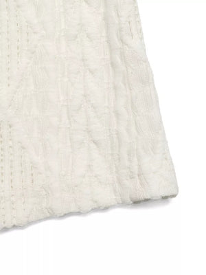 Diamond knit maternity t-shirt in white with cap sleeves and crew neck.