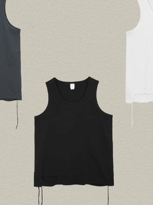 Black raw edge scoop neck tank top with distressed hem detail