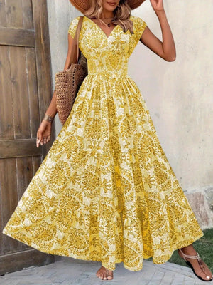 Yellow damask print maxi dress with cap sleeves and V-neck, cinched waist, tiered skirt.