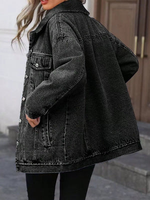 Oversized washed grey denim jacket with button pockets and collar.