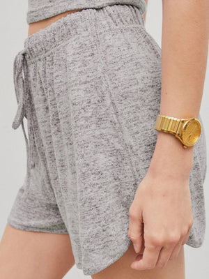 Gray ribbed knit lounge shorts with drawstring waist and curved hem.