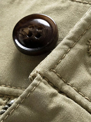 Army green cargo joggers with flap pocket detail and button closure.