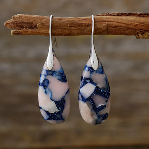 Marbled teardrop earrings with pink, white, and blue gemstone mosaic pattern and silver hooks.