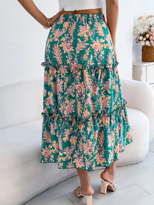 Green floral midi skirt with tiered ruffle hem and smocked waist.