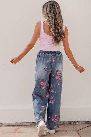 Floral wide-leg denim jeans with elastic waistband and pink floral print.