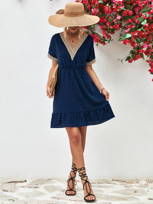 Dark blue Swiss dot dress with crochet trim V-neck and short sleeves, A-line skirt.