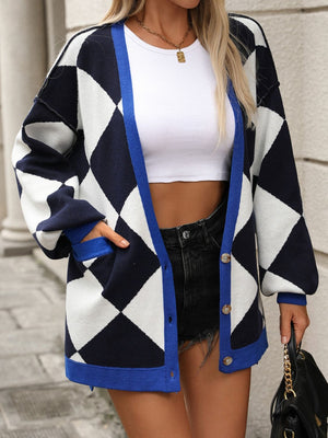 Argyle knit oversized cardigan in navy, white, and blue with pockets and button front.